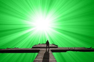 man on a dock with a green backdrop