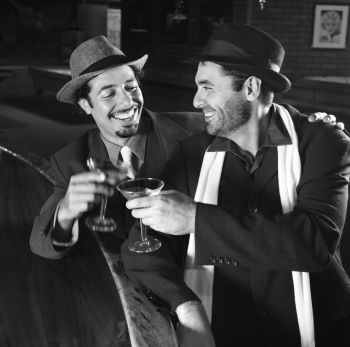 men at speakeasy drinking in the 1920s